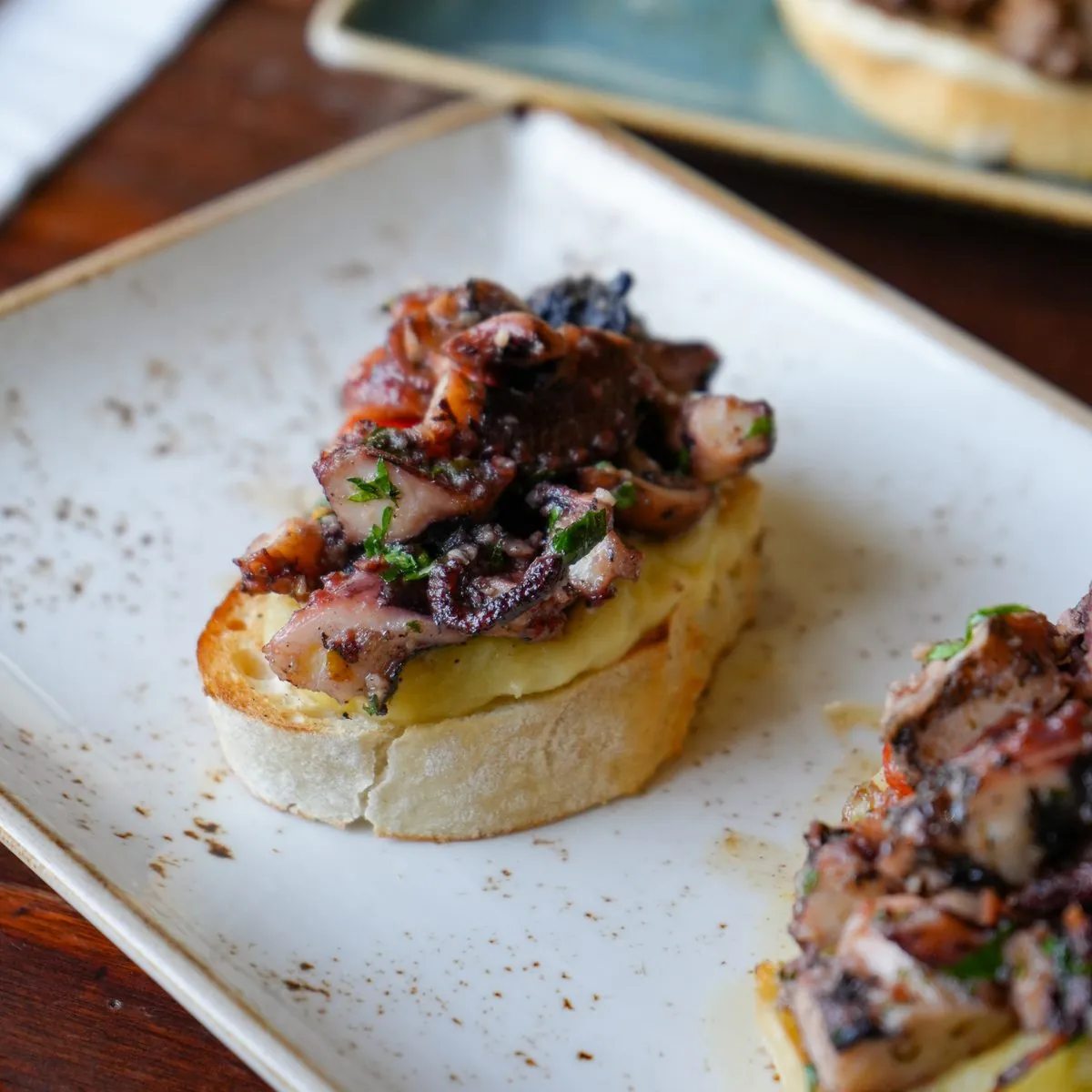 Octopus bruschetta on toasted local bread