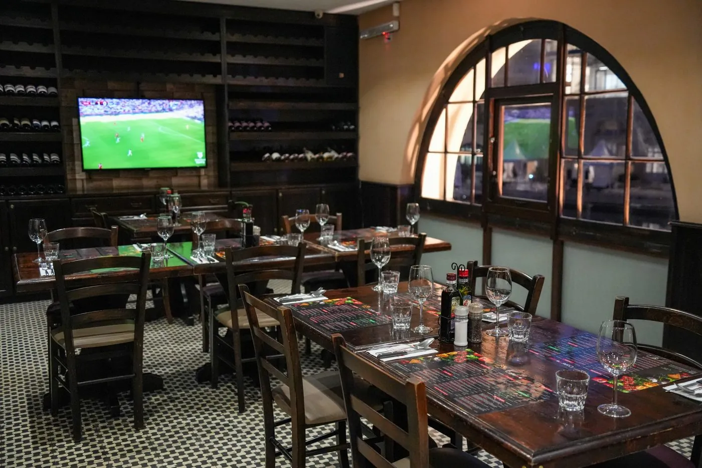Inside Café Rouge — tables set under the arches
